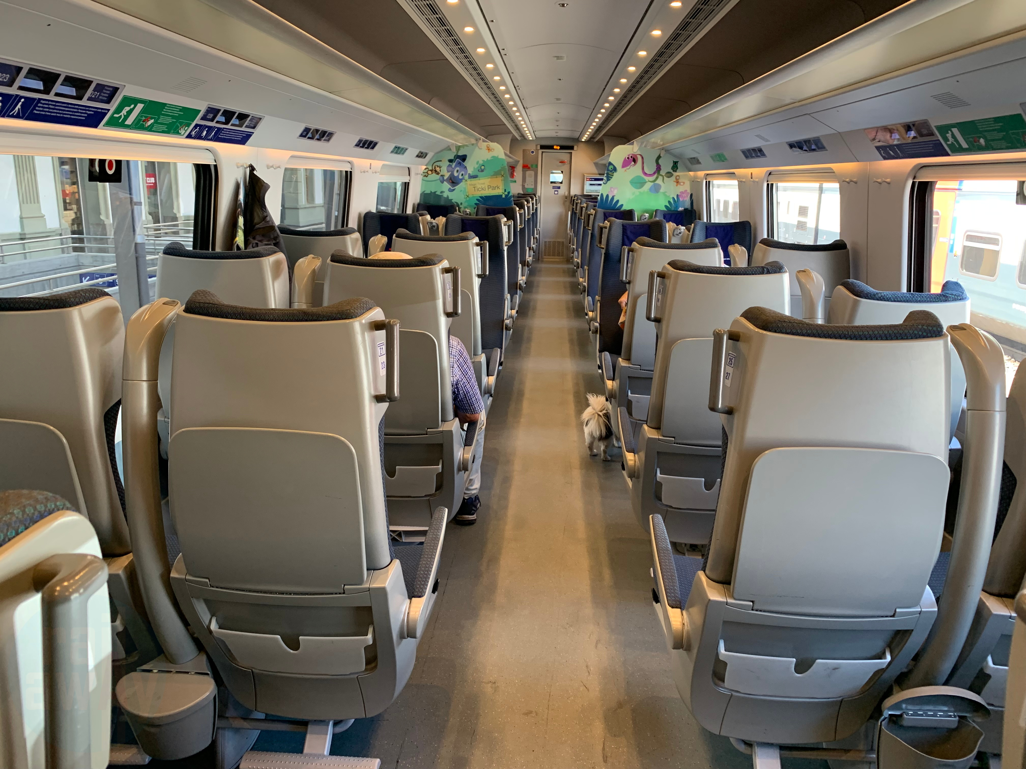 Seats arranged on a 2+2 configuration with seat back tables