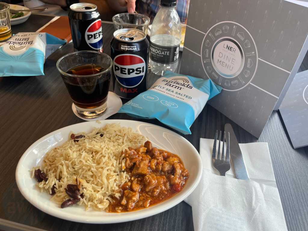 The BBQ Pork with Spiced Rice main course on the LNER Azuma with crisps and a Pepsi Max